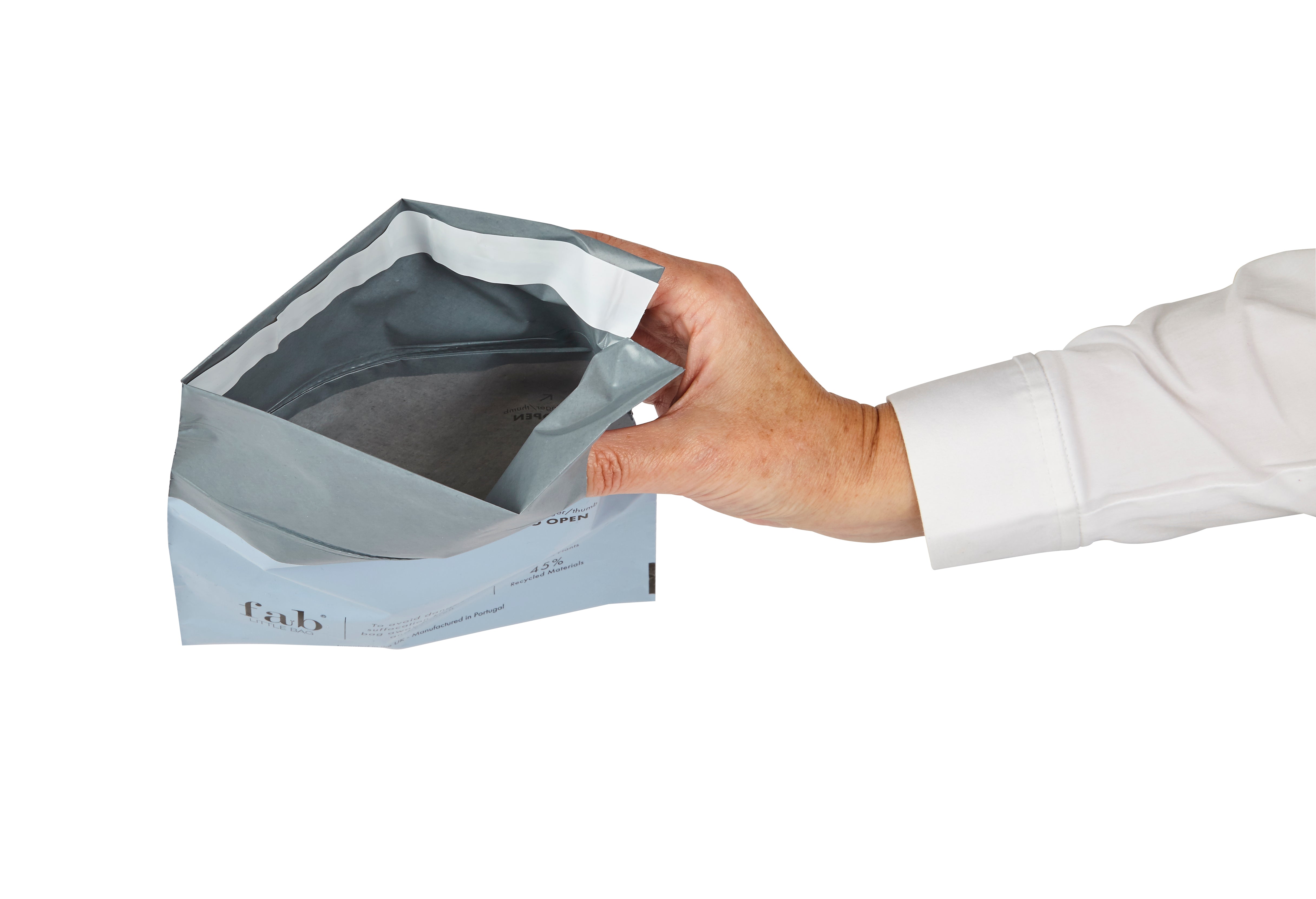 A HyGeeni disposal bag held open in one hand